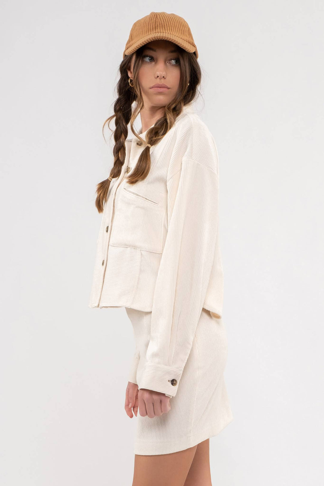 side view of cream color Dusty Sage Button Up Rib Knit Jacket with Collar, Long Sleeves, Pockets, and Pocket Slits.