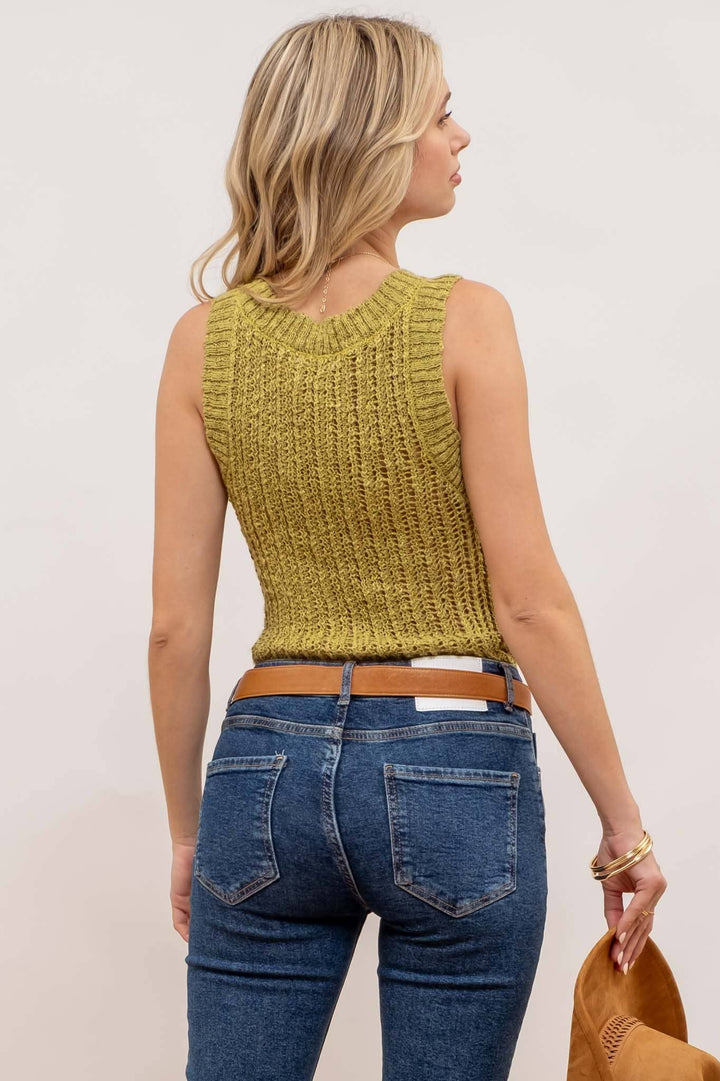 styled back view of Kiwi Crochet Sweater Knit Tank Top with a round neckline and sleeveless design, made from 100% polyester.