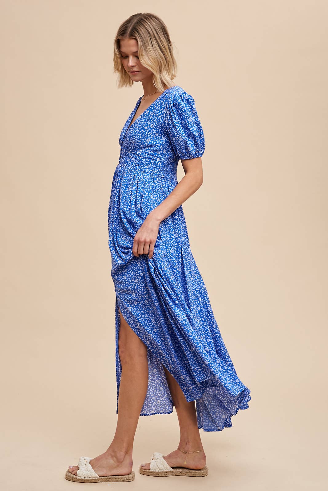 side view of Florence Button Down Maxi Dress with floral print, functional button-down front, ruched waist with smocked elastic back, puff sleeves, and full lining.