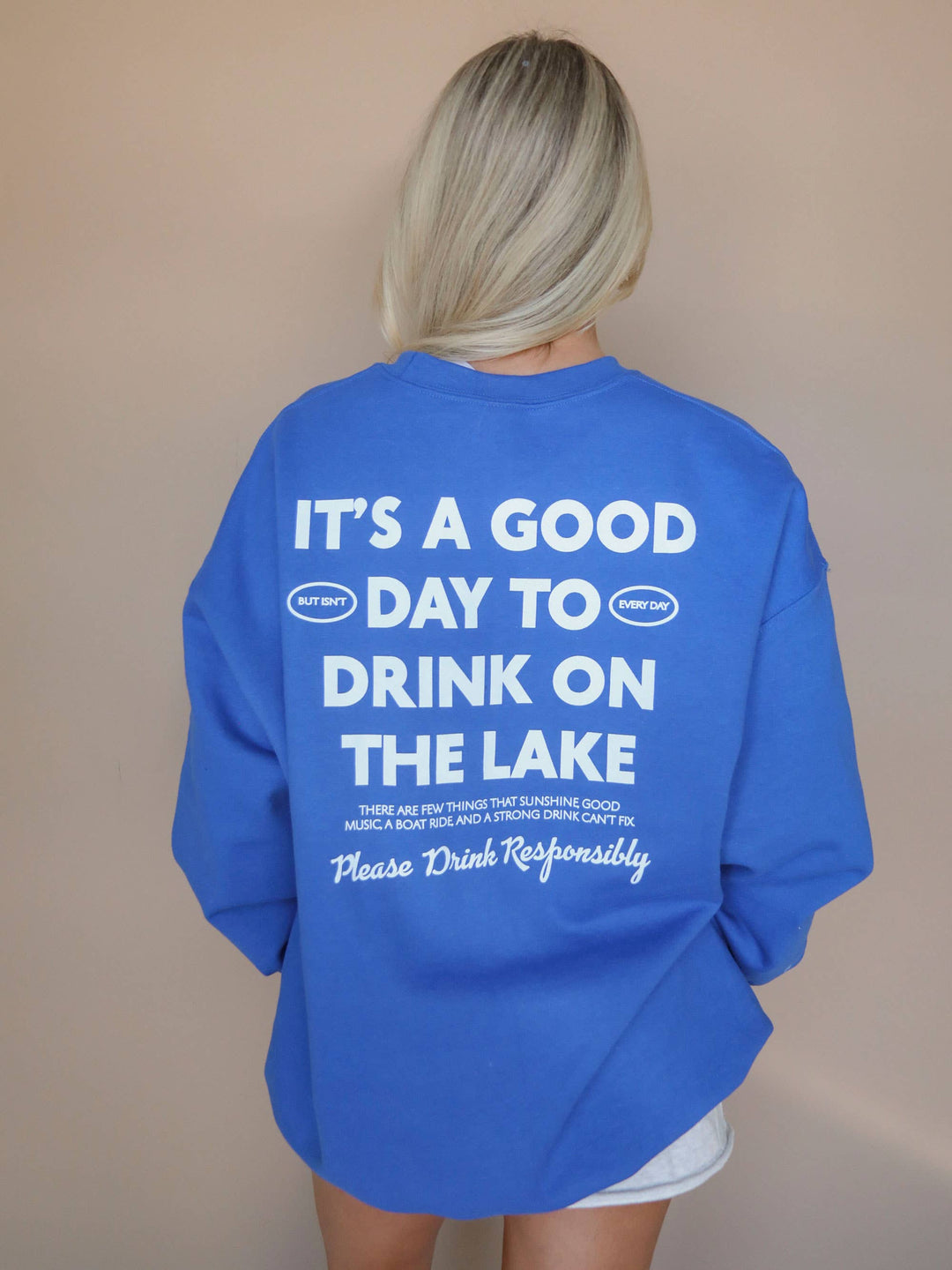 detailed back view of Lake Responsibly' Sweatshirt in blue crewneck, perfect for stylish lake days. Ideal gift when paired with a drink sleeve. Emphasizes responsible enjoyment of lake activities.