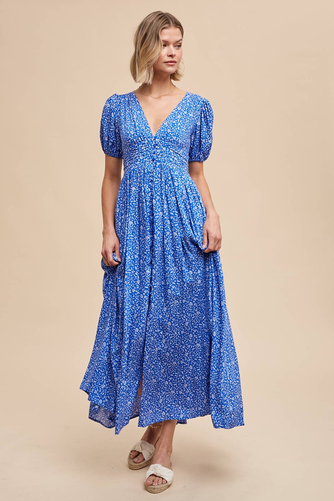 front view of Florence Button Down Maxi Dress with floral print, functional button-down front, ruched waist with smocked elastic back, puff sleeves, and full lining.