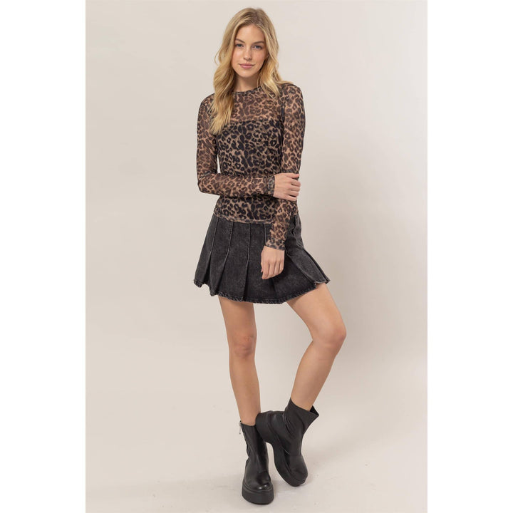 zoomed out view of Animal Print Mesh Top featuring a classic crew neck and fitted long sleeves, designed for a flattering fit, available at Onyx Native.