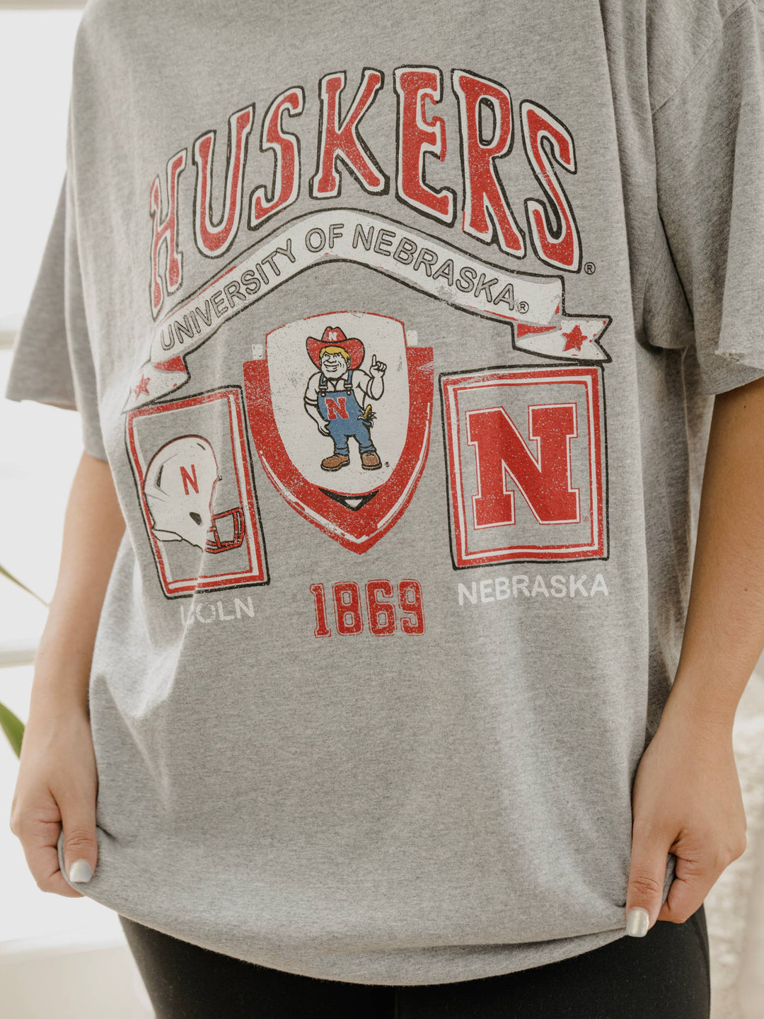 zoomed in view of Our 100% Preshrunk Cotton, vintage inspired, graphic thrifted tees are meaningfully distressed.