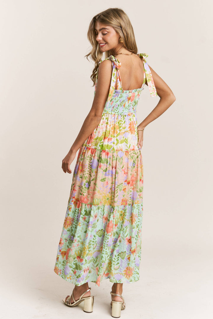 back view Garden Dream Tiered Multi Print Maxi Dress — floral print, smocked bodice, tie shoulders, true-to-size fit by Onyx Native