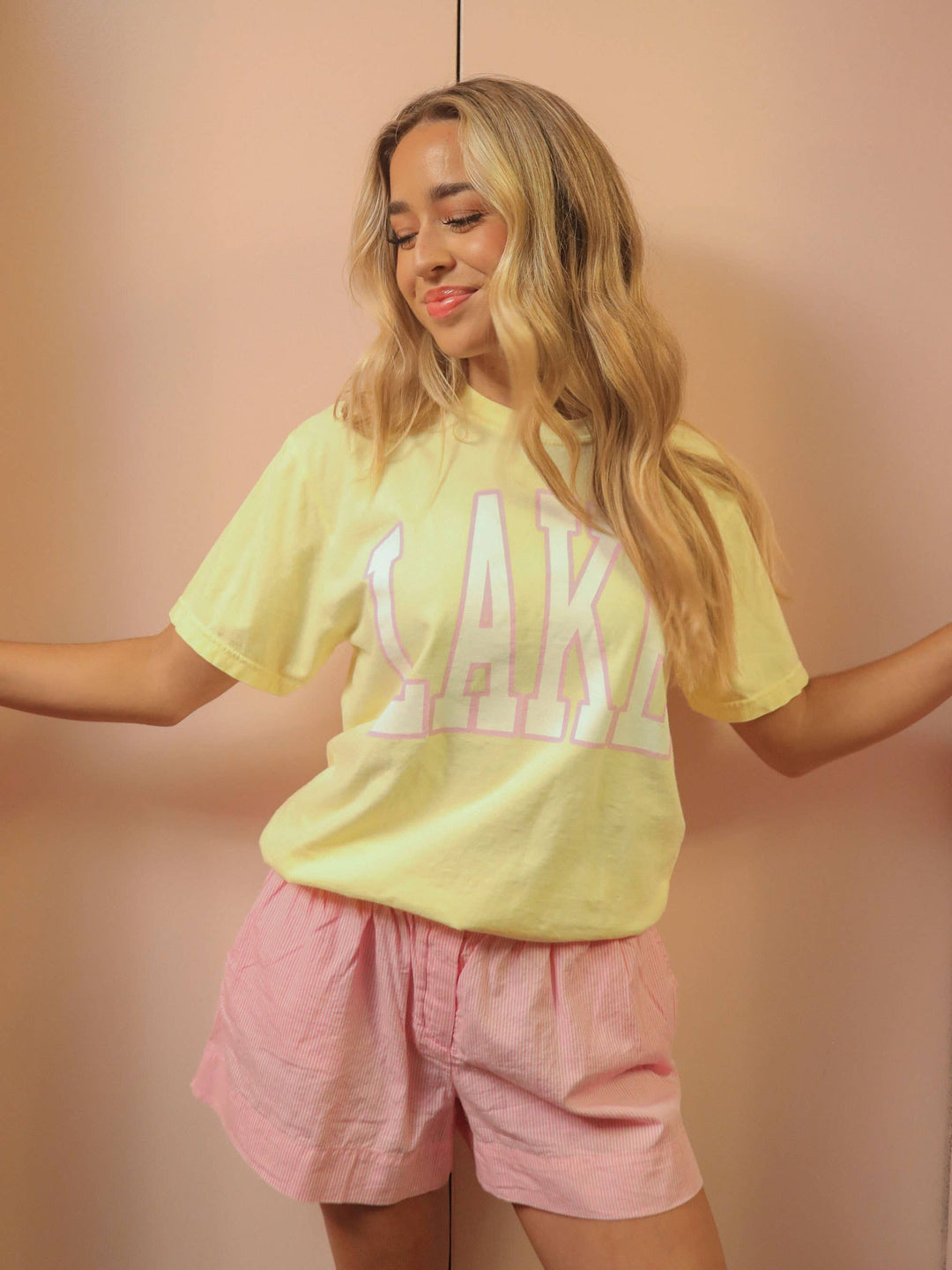 front view LAKE Oversized Tee — sunshine yellow Comfort Colors® tee with varsity pink and white lettering, perfect for lake days by Onyx Native