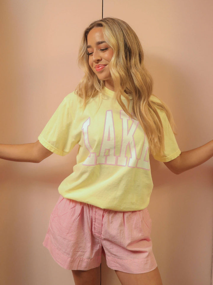 front view LAKE Oversized Tee — sunshine yellow Comfort Colors® tee with varsity pink and white lettering, perfect for lake days by Onyx Native