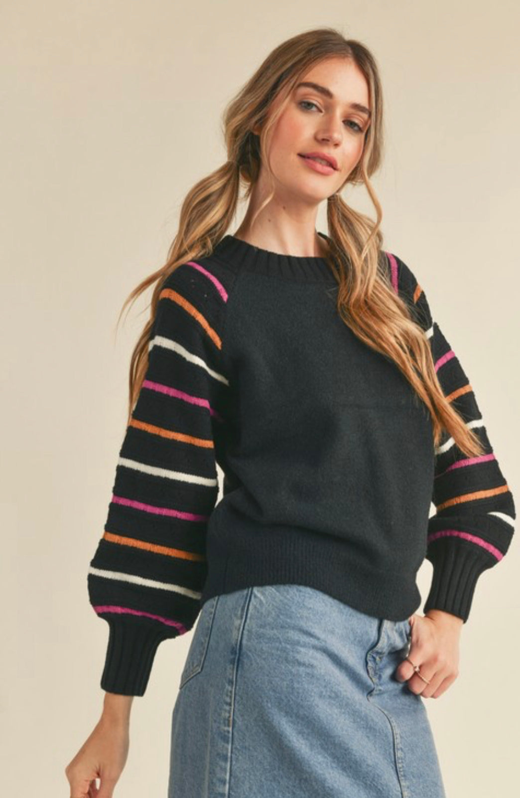 front view of Relaxed fit pullover with ribbed neck, sleeve, and waist details. Features balloon sleeves for added style.