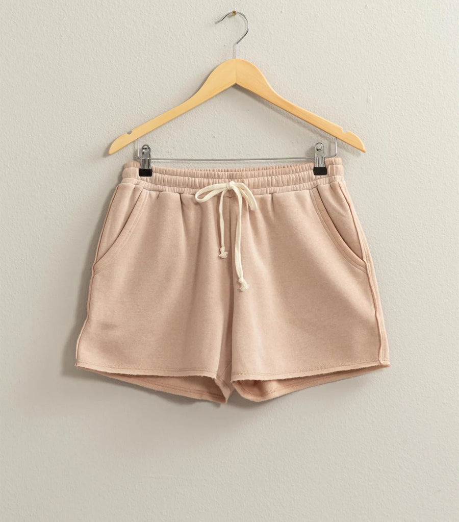 Josie Drawstring Lounge Shorts in soft stretch knit with banded waist, adjustable drawstring, and raw-cut hem. Relaxed fit for comfort. Made from 51% cotton and 49% polyester.