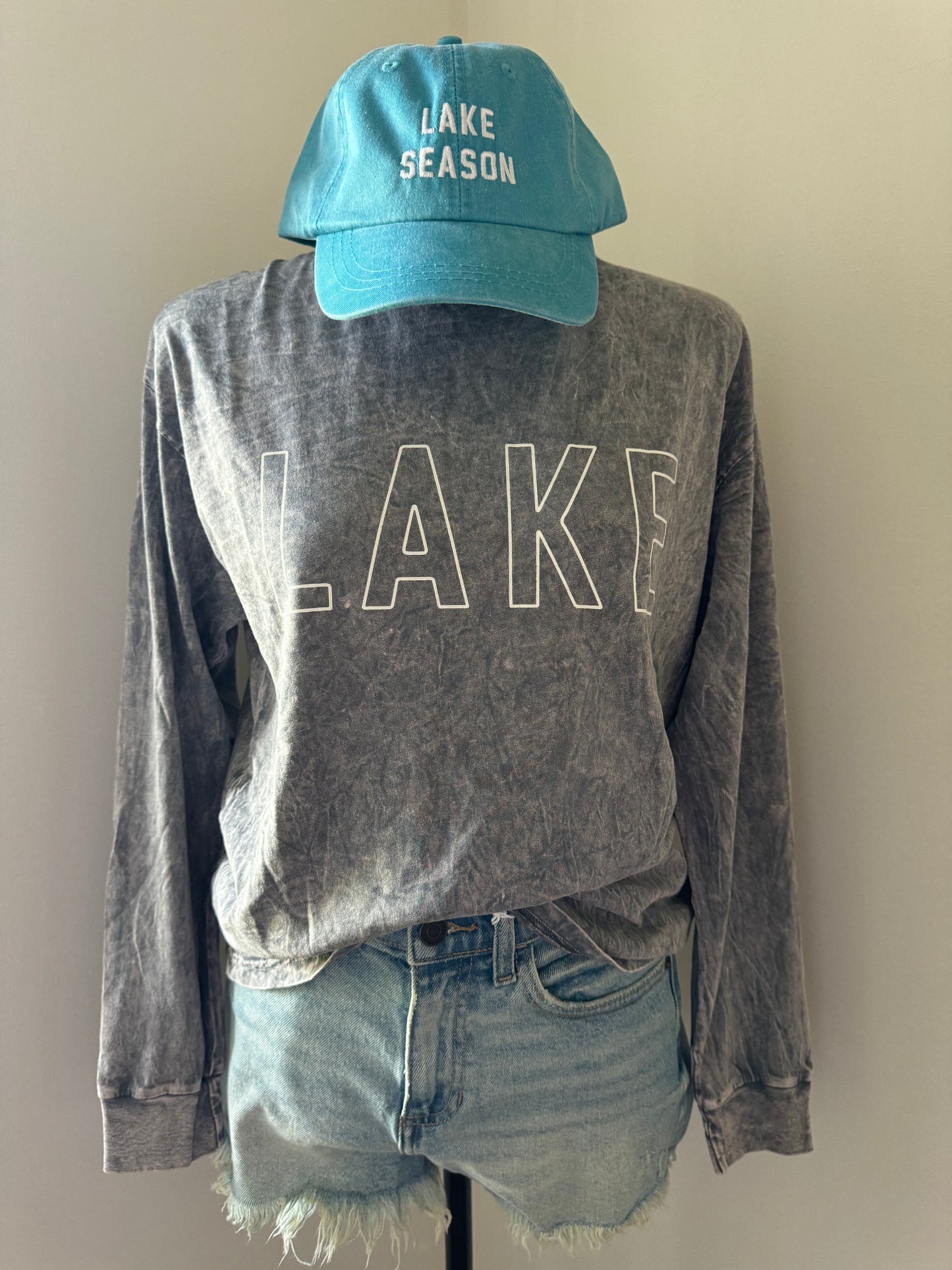 another mannequin view of LAKE Mineral Washed Long Sleeve Graphic Top, 100% cotton jersey, relaxed boxy fit, cuffed sleeves, screen-printed with water-based ink, exclusive Oat Collective label.