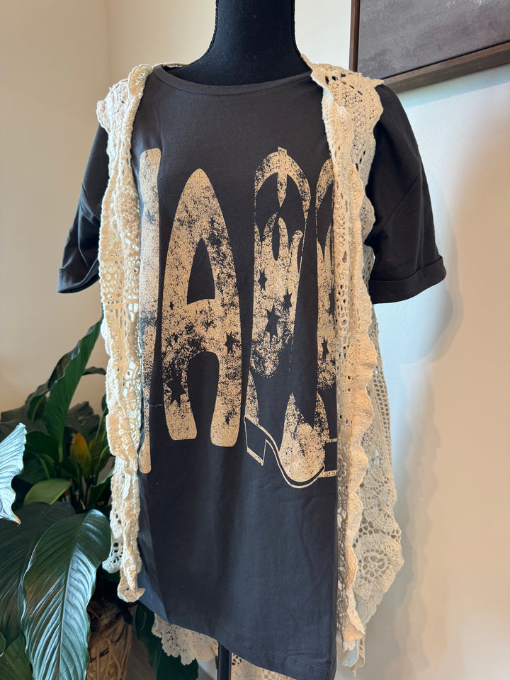 styled mannequin view of Ya'll Cowboy Boots Vintage Wash Graphic Tee with 'Ya'll' text, stars, and cowboy boots graphics. Oversized fit, mineral washed, round neckline, short cuffed sleeves, and dropped shoulders