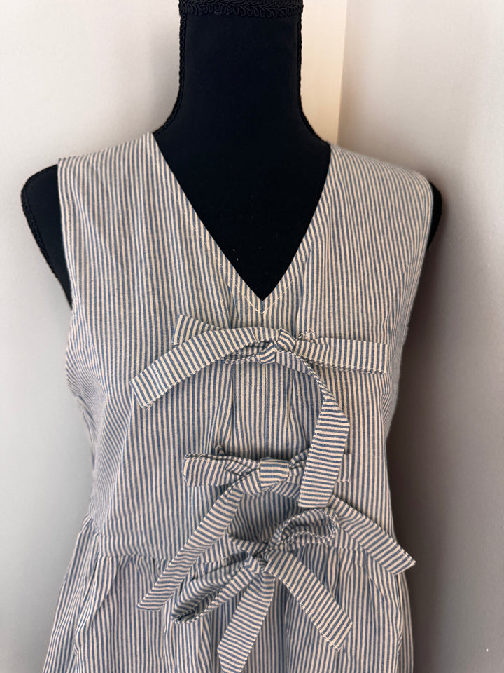 close up Blue Lilly Linen Dress — soft linen mini dress with classic stripes and playful cotton bow, summer-ready style by Onyx Native