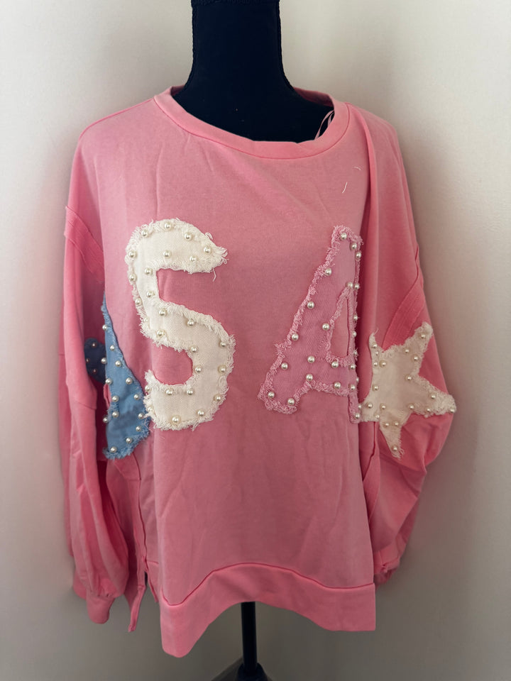 USA Pink Pearl Sweater — oversized 100% cotton sweater with playful blue USA pearl accent, cozy and patriotic style by Onyx Native