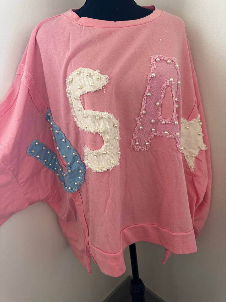 front view USA Pink Pearl Sweater — oversized 100% cotton sweater with playful blue USA pearl accent, cozy and patriotic style by Onyx Native