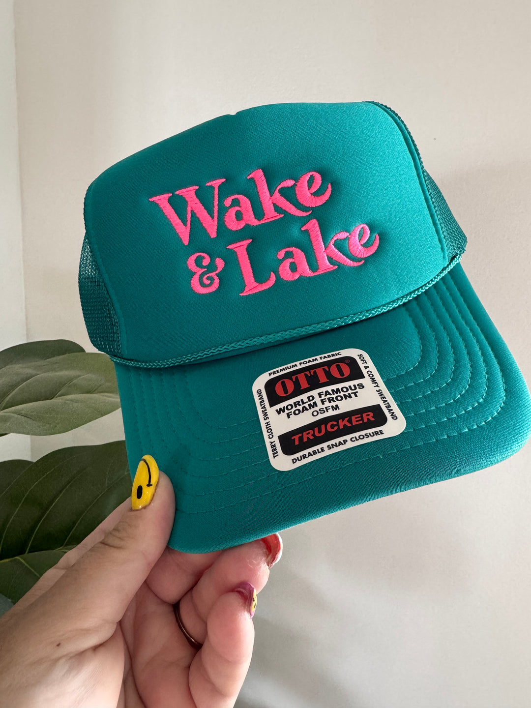 with sticker Wake & Lake Foam Trucker Hat — adjustable snapback summer hat, lightweight foam design, made in a women-owned shop by Onyx Native
