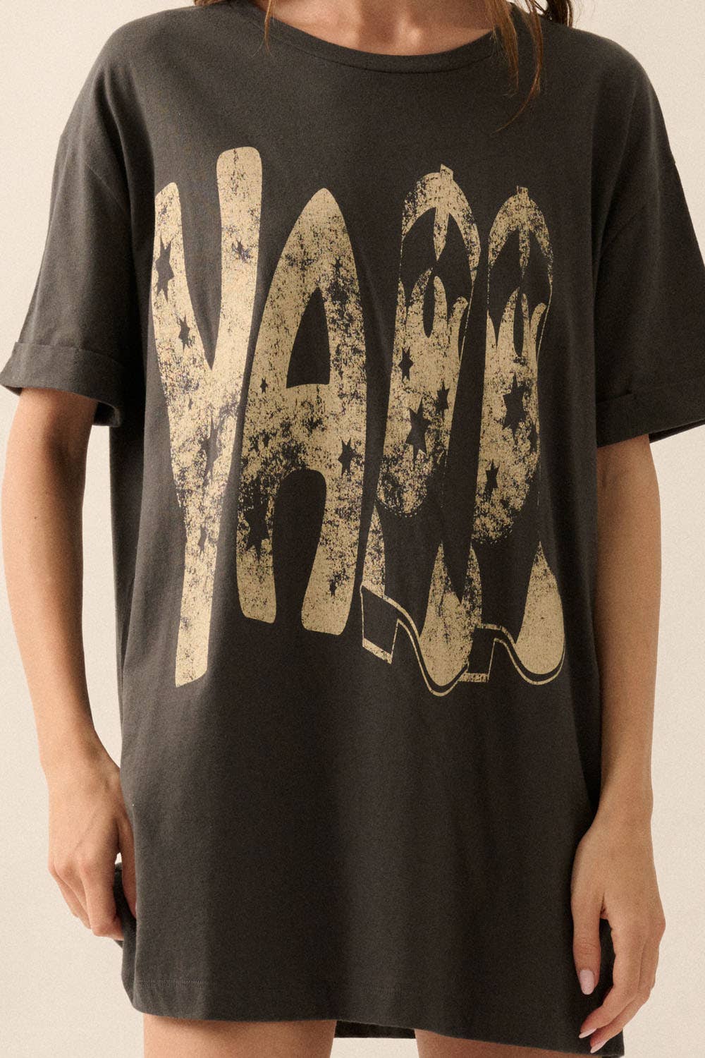 close up view of Ya'll Cowboy Boots Vintage Wash Graphic Tee with 'Ya'll' text, stars, and cowboy boots graphics. Oversized fit, mineral washed, round neckline, short cuffed sleeves, and dropped shoulders
