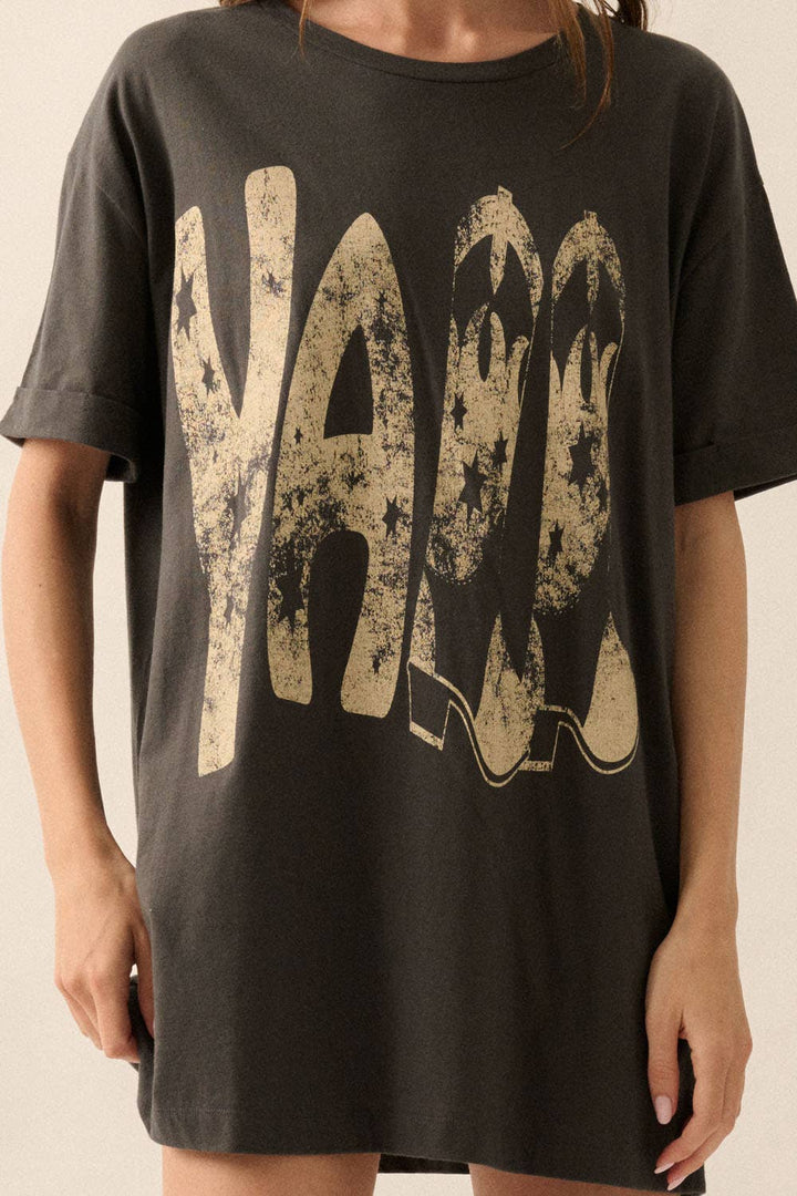 close up view of Ya'll Cowboy Boots Vintage Wash Graphic Tee with 'Ya'll' text, stars, and cowboy boots graphics. Oversized fit, mineral washed, round neckline, short cuffed sleeves, and dropped shoulders