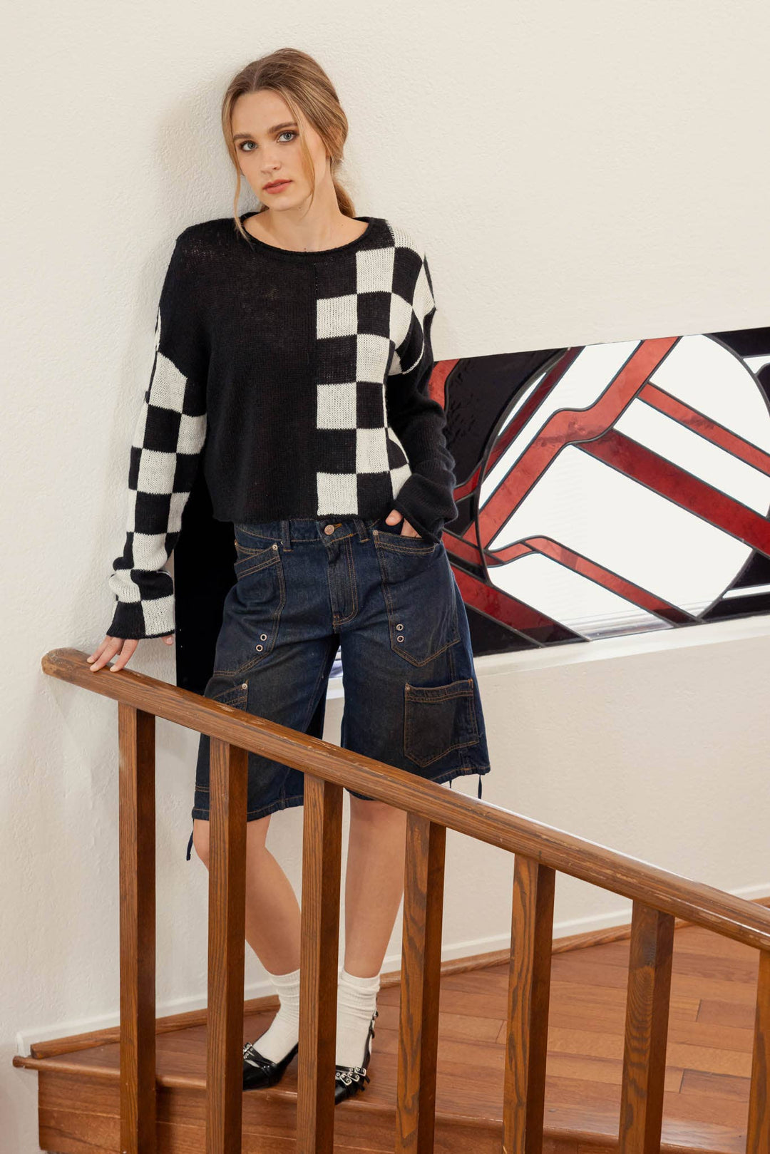 zoomed out view of Hit the Track Colorblock Checkered Knit Sweater featuring a boat neckline and long sleeves, made from 100% acrylic, available at Onyx Native.