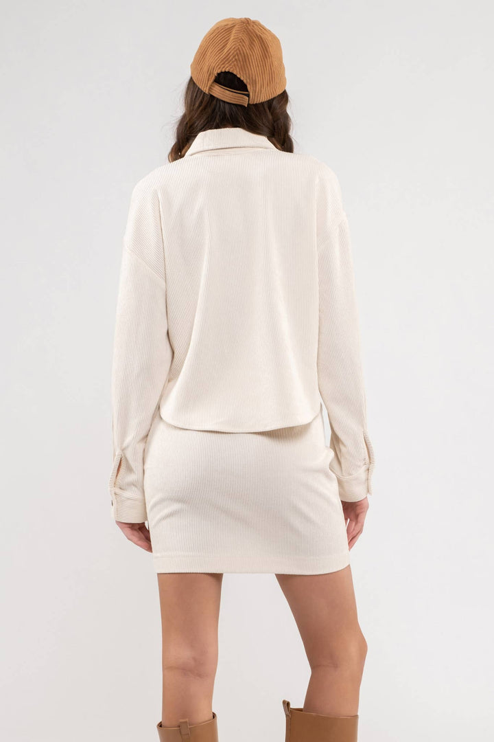 back view of cream color Dusty Sage Button Up Rib Knit Jacket with Collar, Long Sleeves, Pockets, and Pocket Slits.