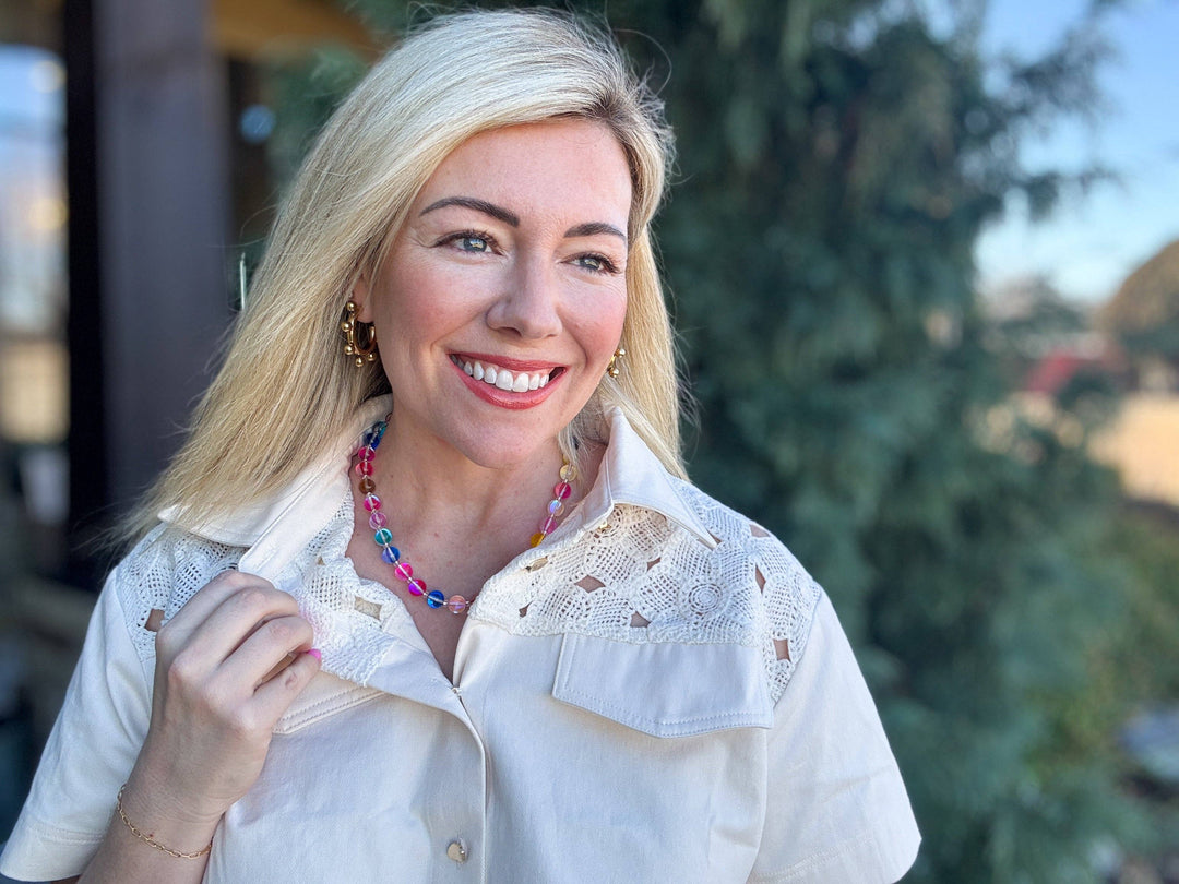 neckline with white Multi-Colored + Clear Beaded Necklace — glass and seed beads with magnetic clasp and gold-plated extender, perfect for layering by Onyx Native