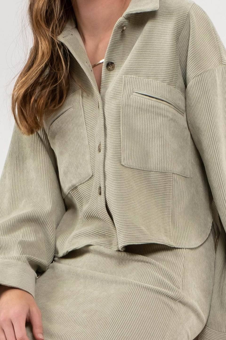 Dusty Sage Button Up Rib Knit Jacket with Collar, Long Sleeves, Pockets, and Pocket Slits.