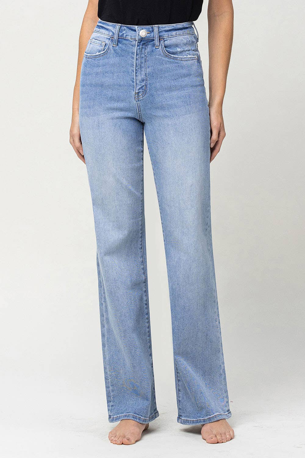 90's vintage super high rise flare jeans with comfort stretch denim, full length, and flare legs. Front rise: 11.5 inches, inseam: 32 inches, leg opening: 20 inches. Model is 5'9'' wearing size 26.