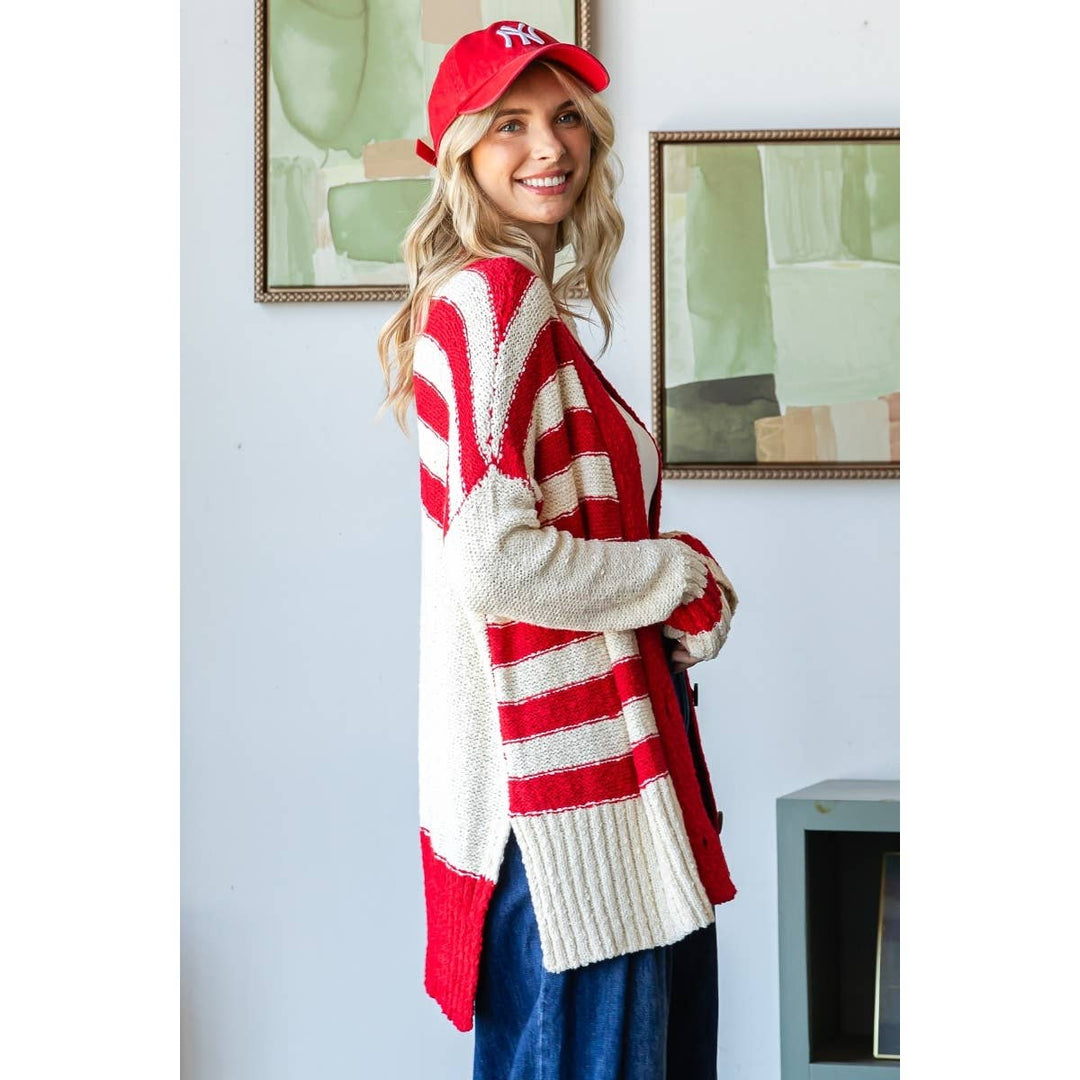 Slight side view of Sally Stripe Mix Oversize Cardigan with 3-button front, solid stripe accents, and side slit design, available at Onyx Native.