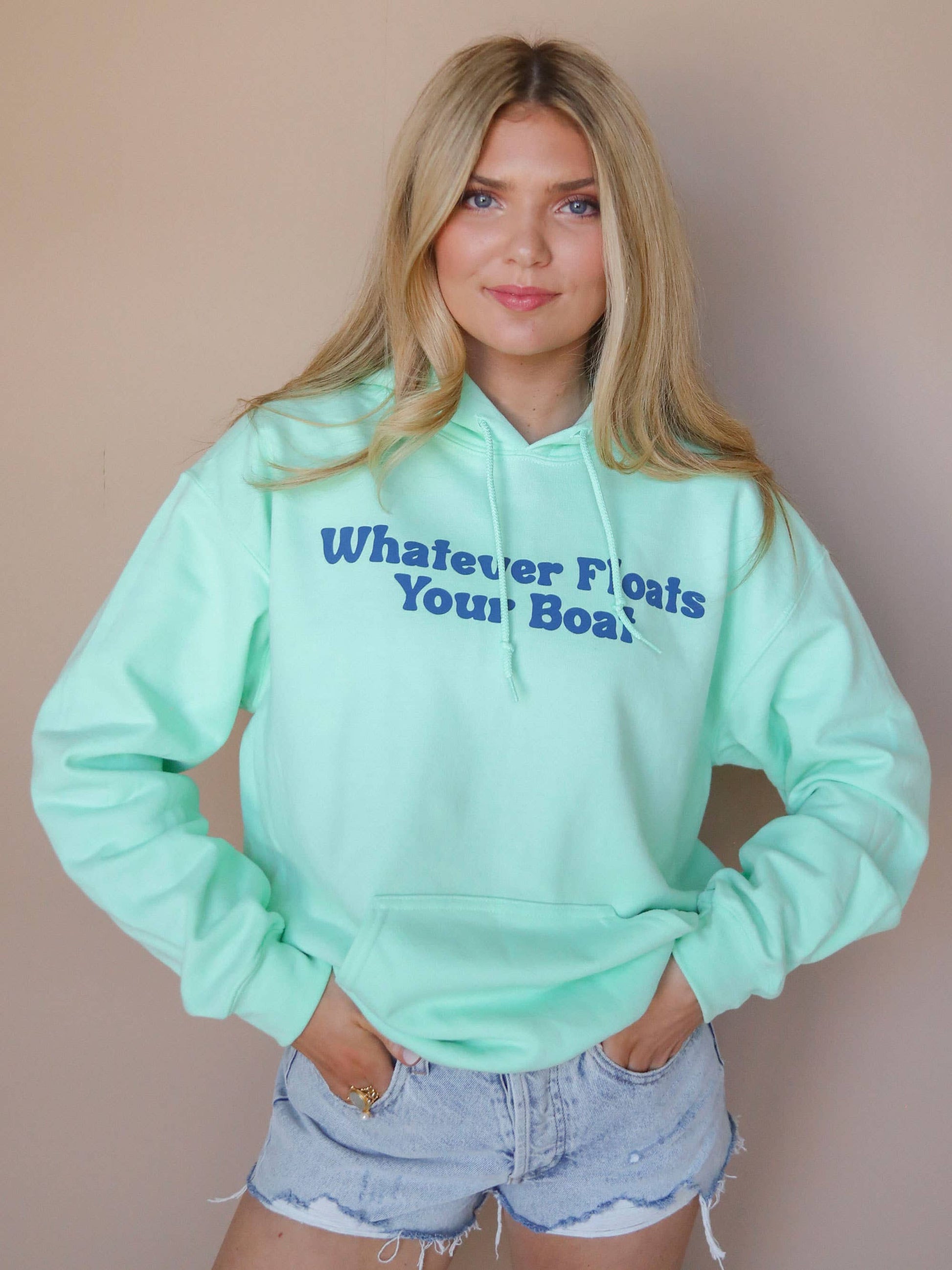 model view of Whatever Floats Your Boat' Hoodie in lime green with bright front and back designs. Perfect for lake days. Available in sizes Small to XL. 