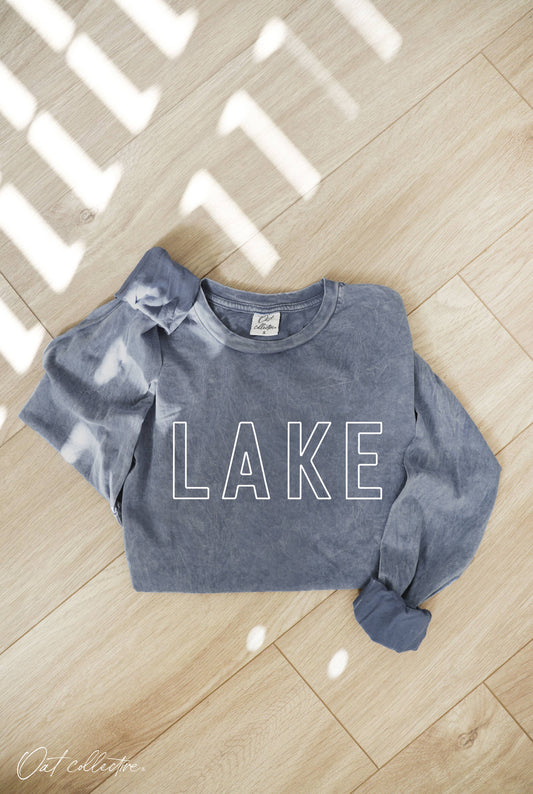 LAKE Mineral Washed Long Sleeve Graphic Top, 100% cotton jersey, relaxed boxy fit, cuffed sleeves, screen-printed with water-based ink, exclusive Oat Collective label.