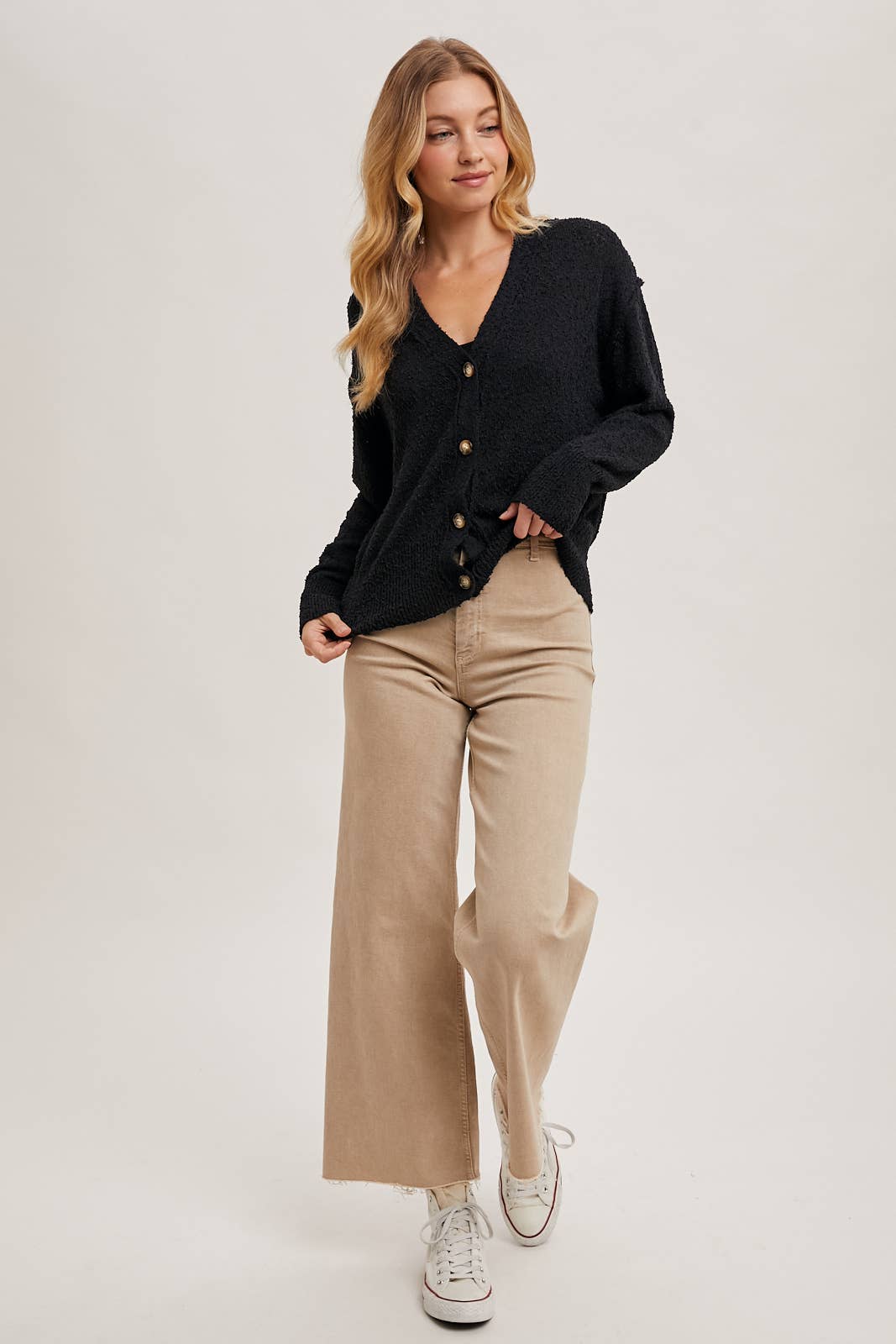 zoomed out styled view of Black Betty Button-Down Cardigan with a classic button front, relaxed fit, and long sleeves, made from soft knit fabric for cozy layering, available at Onyx Native.