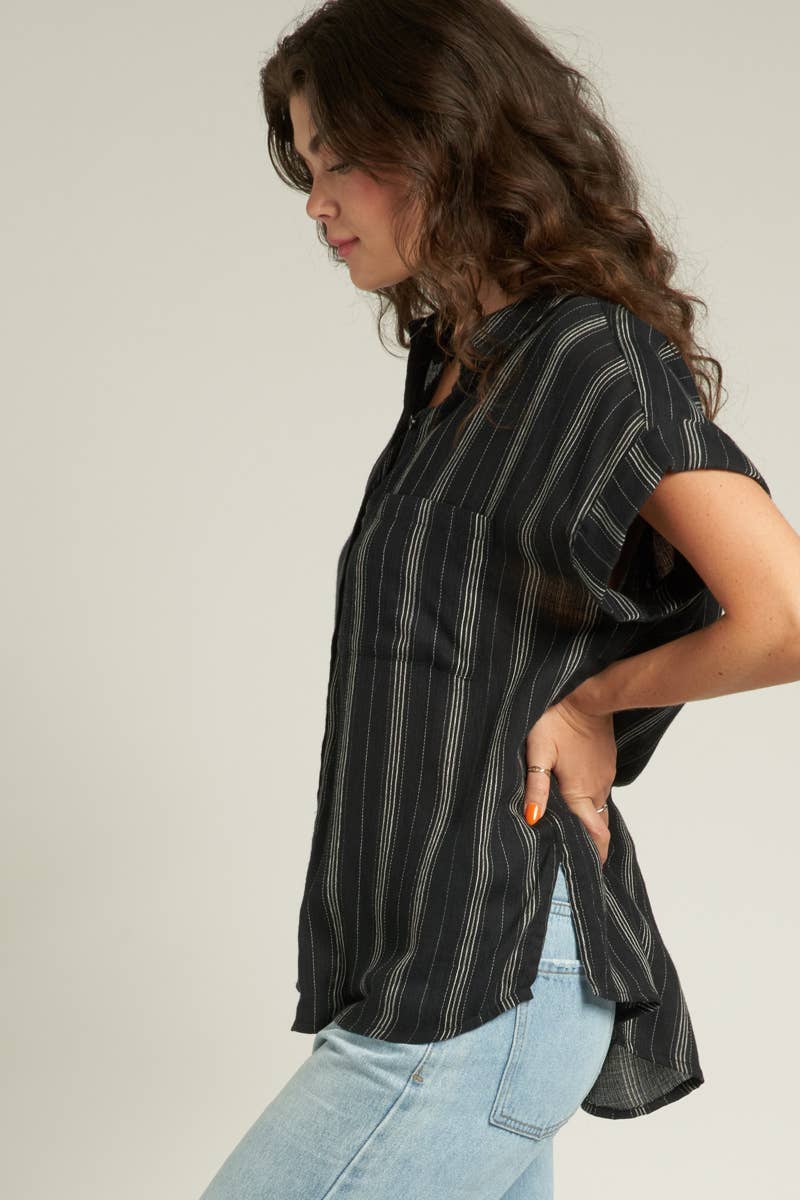 side view of Stevie Striped Sleeve Button Down Top with short striped sleeves, made from 100% cotton. Model is 5'10" and wearing a size small.