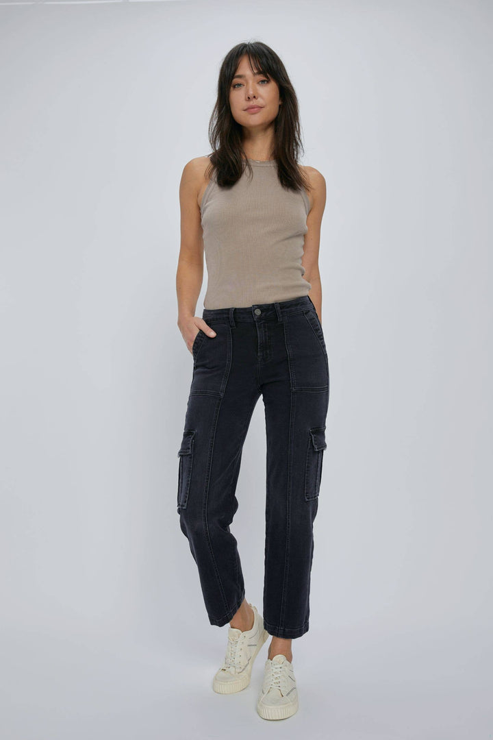zoomed out front view of Black stretch cargo pocket straight jeans. Features include a rise of 10 inches and an inseam of 28 inches. Model is wearing size 26. Made of 65% cotton, 21% rayon, 11% polyester, and 2% spandex.