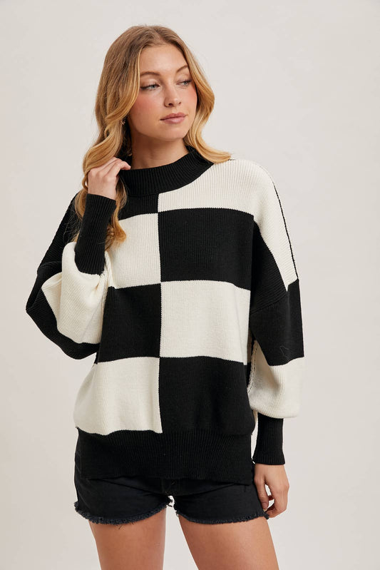 Black Color Block Sweater with dolman sleeves, soft knit fabric, and a stylish design, perfect for versatile styling, available at Onyx Native.