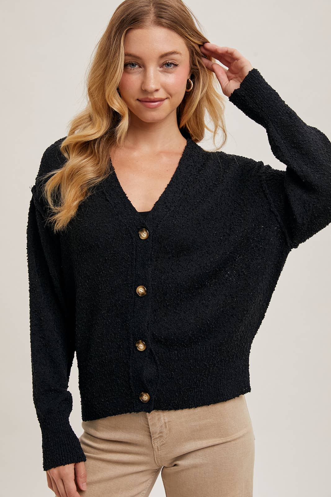 Black Betty Button-Down Cardigan with a classic button front, relaxed fit, and long sleeves, made from soft knit fabric for cozy layering, available at Onyx Native.