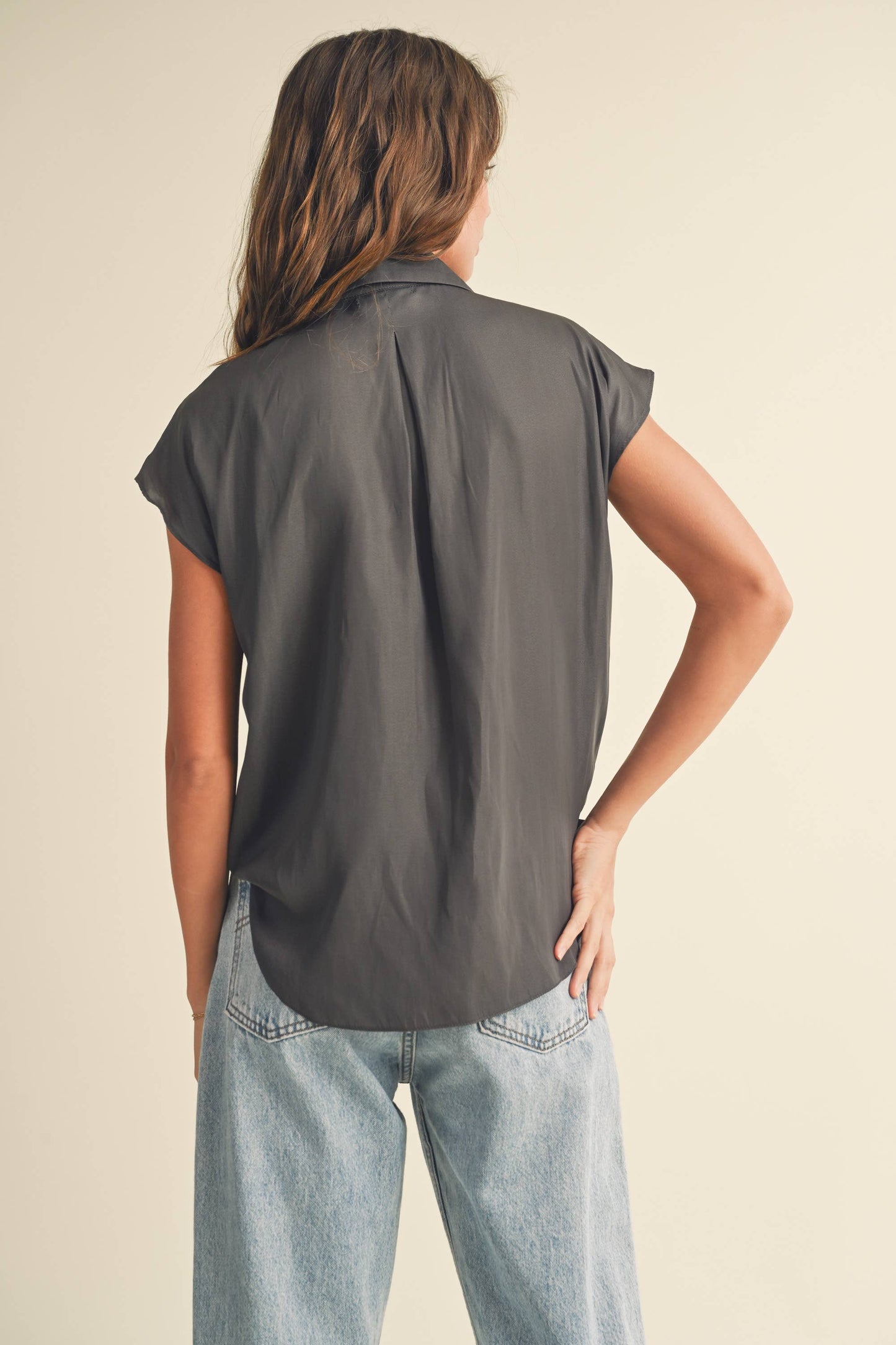 back view of gray colored Button-down cap sleeve shirt in a light and breathable fabric.