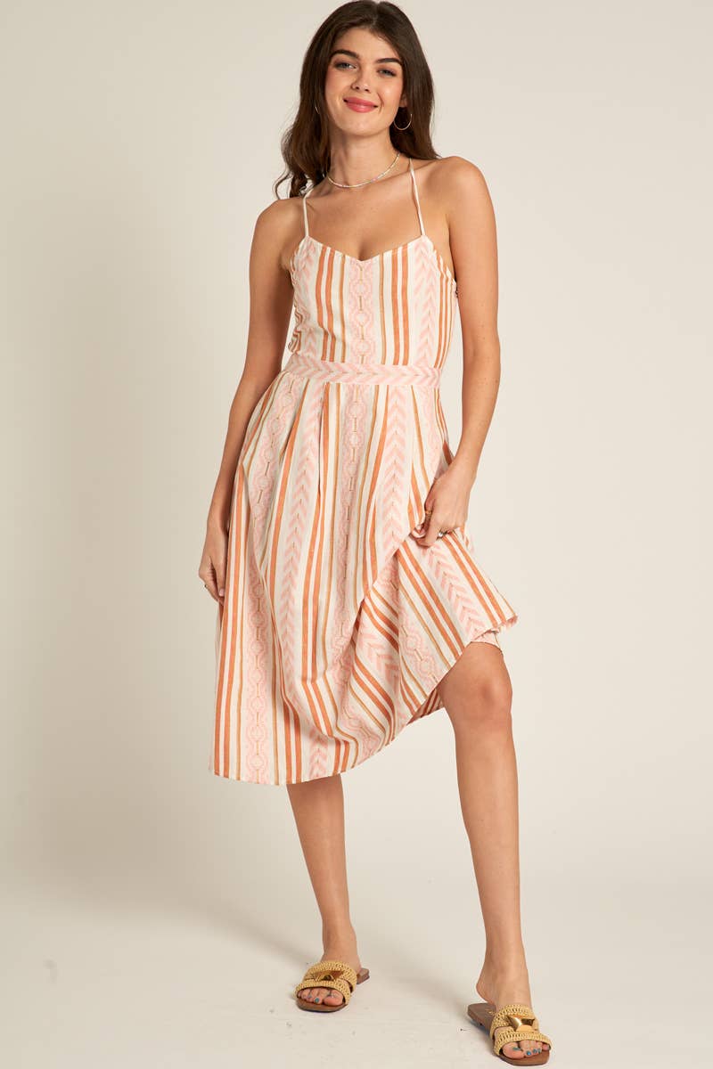 Marie Back Cross Cami Midi Dress in white and coral, made from 98% cotton and 2% lurex. Features a back cross design. Model is 5'8" and wearing a size small.