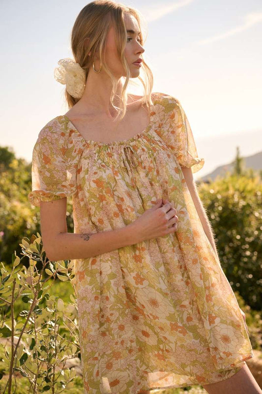 Vintage Flower Print Mini Dress with square neck, short puff sleeves, and tie detail on top. Made from chiffon woven fabric and fully lined. Model is 5'9" wearing size Small.