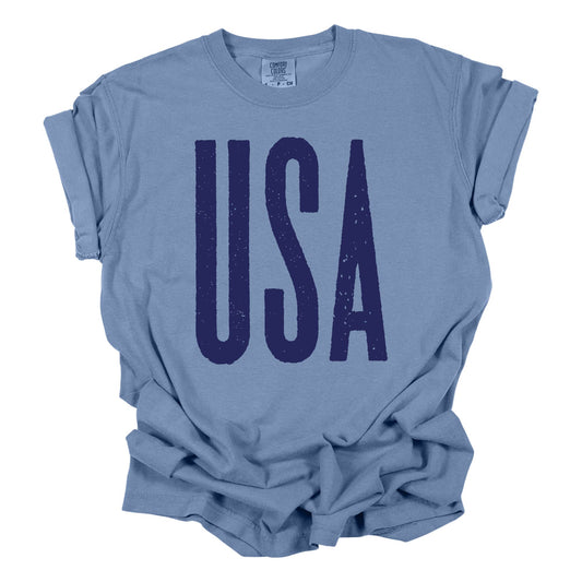 USA 4th of July Graphic Shirt, 100% cotton Comfort Colors in washed denim and white, relaxed fit, unisex, and Bella Canvas 60/40 cotton-poly blend in red and royal.