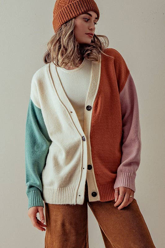 slight side view of Hailee Multicolor Cardigan Sweater with button-down front, colorful ribbed cuffs and hem, designed for a slightly oversized fit, available at Onyx Native.