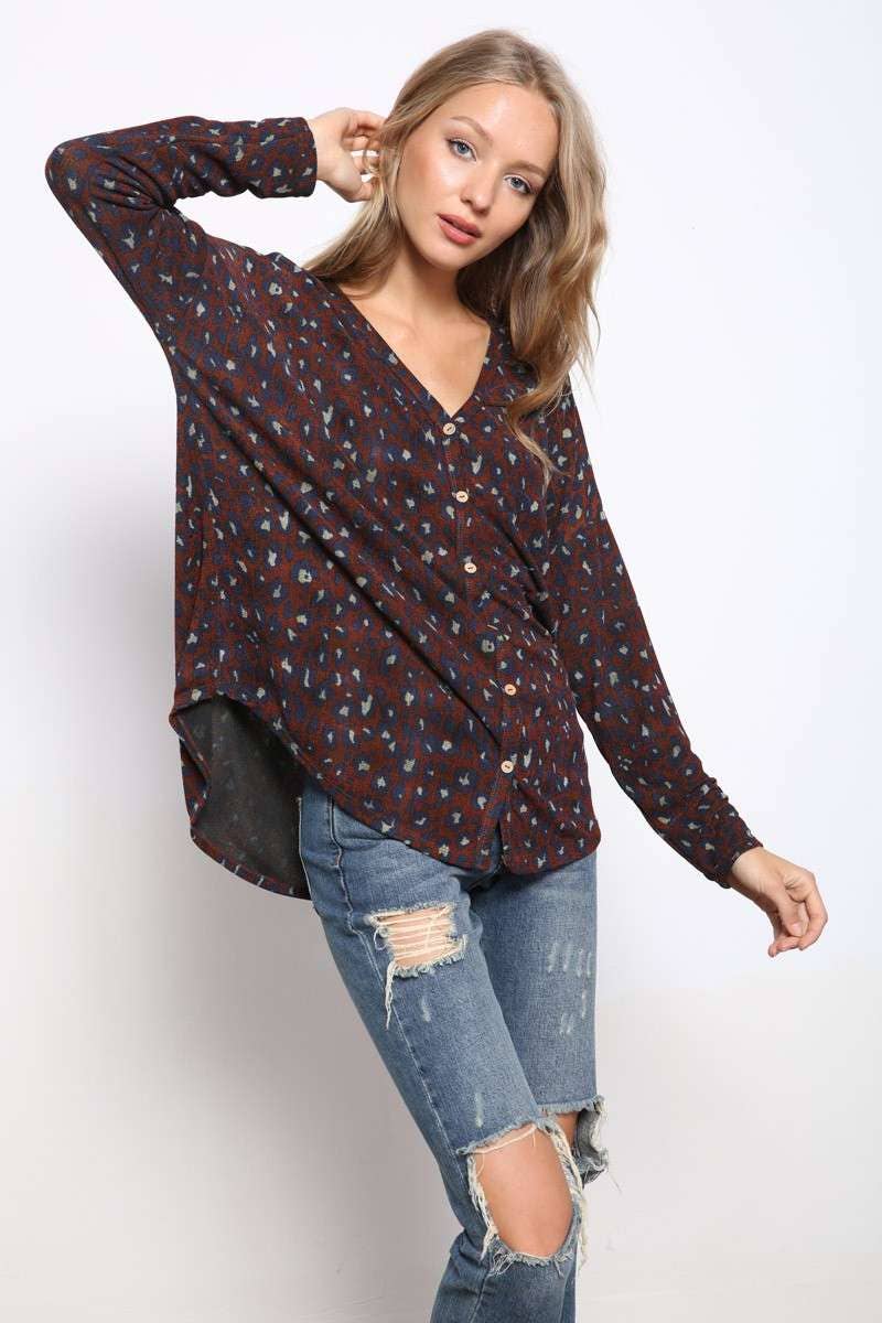 side view of Animal Print Button Front Knit Top with V-neckline, button front detail, drop shoulders, long sleeve