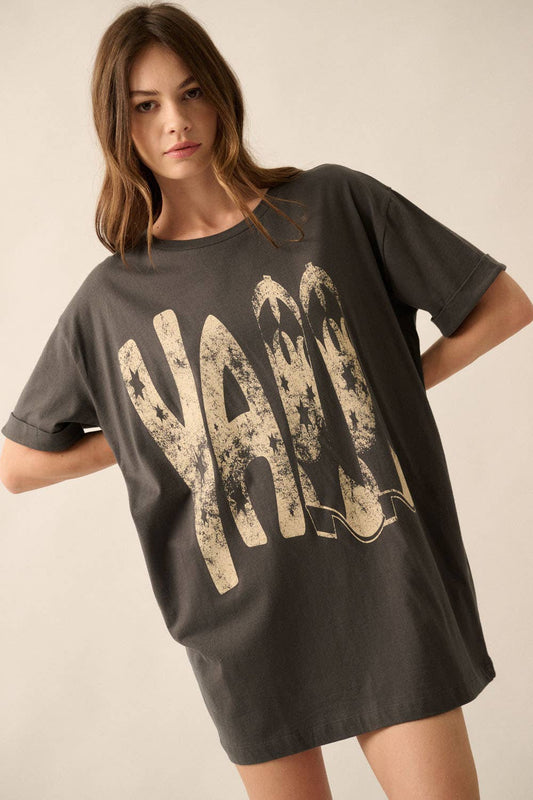 Ya'll Cowboy Boots Vintage Wash Graphic Tee with 'Ya'll' text, stars, and cowboy boots graphics. Oversized fit, mineral washed, round neckline, short cuffed sleeves, and dropped shoulders