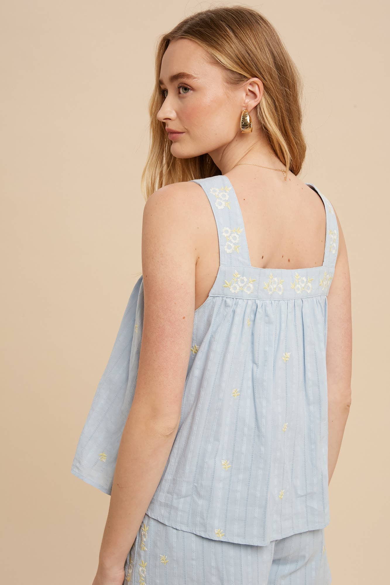 back view of Smock tank top featuring full lining and all-over floral embroidery.