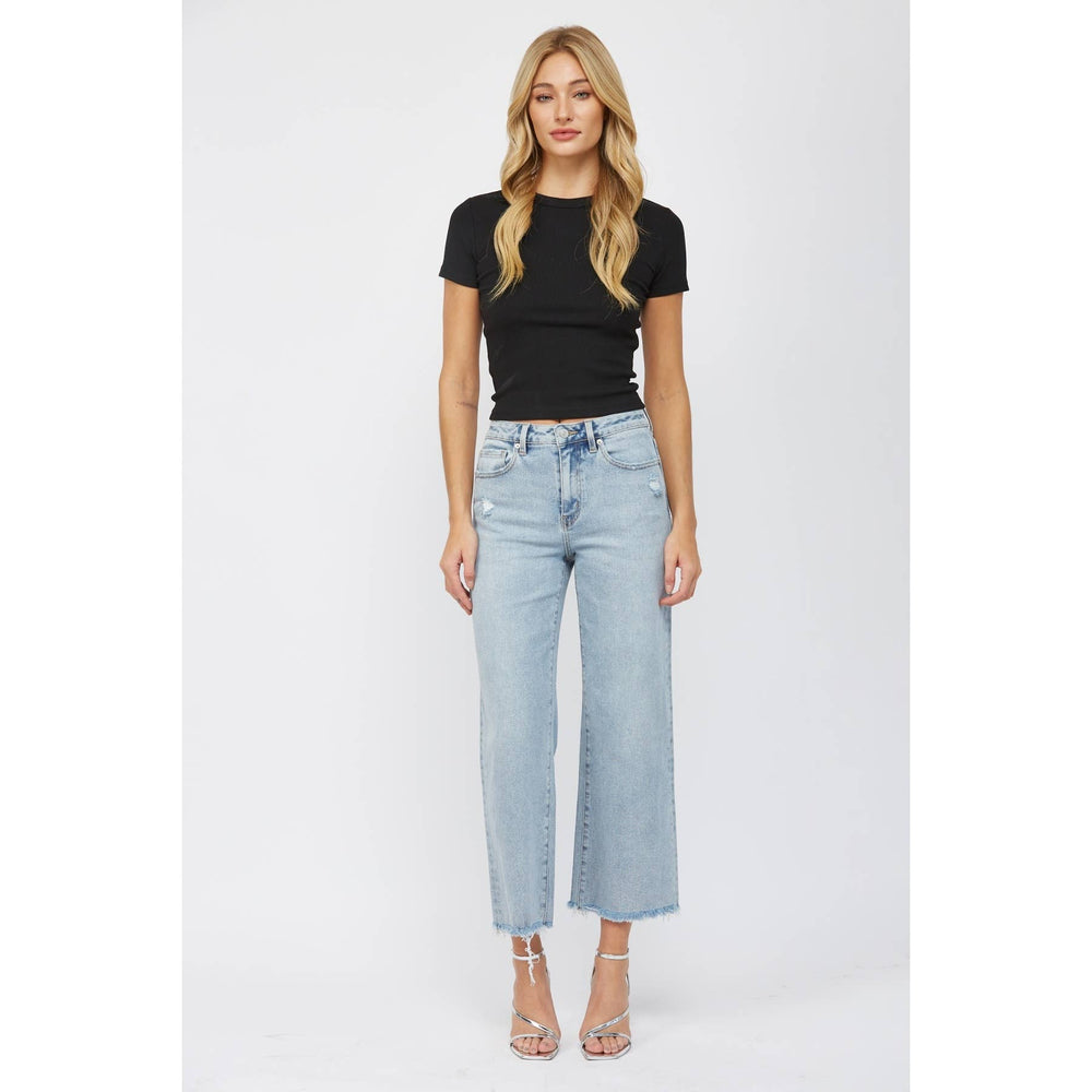 front view of High-rise ankle wide-leg jeans in light wash with minimal distressing. Made from 98% cotton and 2% spandex.
