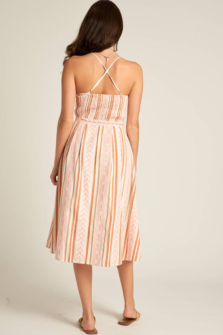 back view of Marie Back Cross Cami Midi Dress in white and coral, made from 98% cotton and 2% lurex. Features a back cross design. Model is 5'8" and wearing a size small.