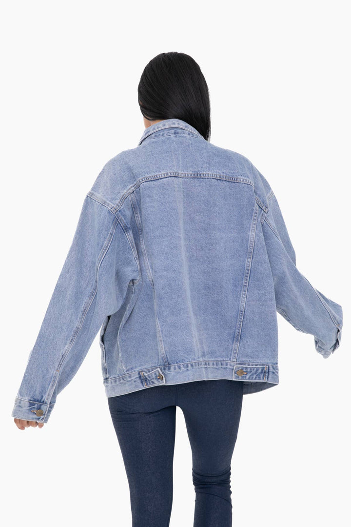 back view of. Roxy Boxy-Cut Denim Jacket in 100% cotton, oversized fit with breast and side pockets, available at Onyx Native.