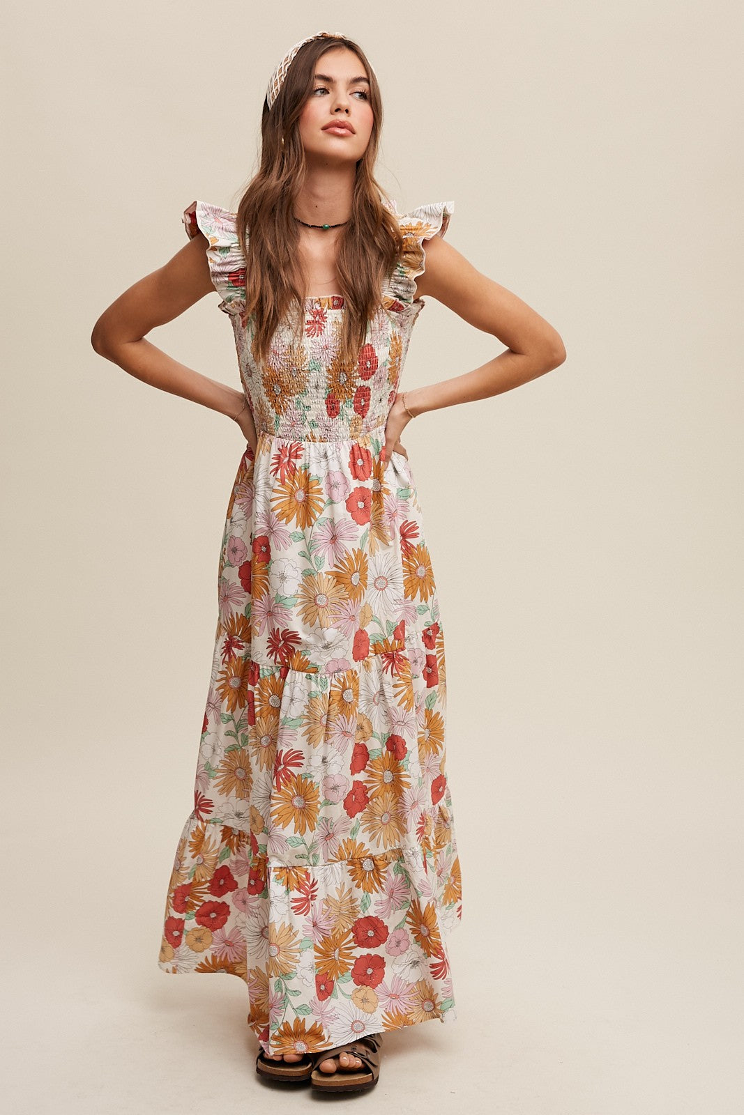 Flower Power Maxi Dress with flower print, smocked top, smocked ruffle sleeves, tiered skirt, and hidden side seam pockets. Fully lined with a clean hem. Model is 5'7.5" wearing size Small.