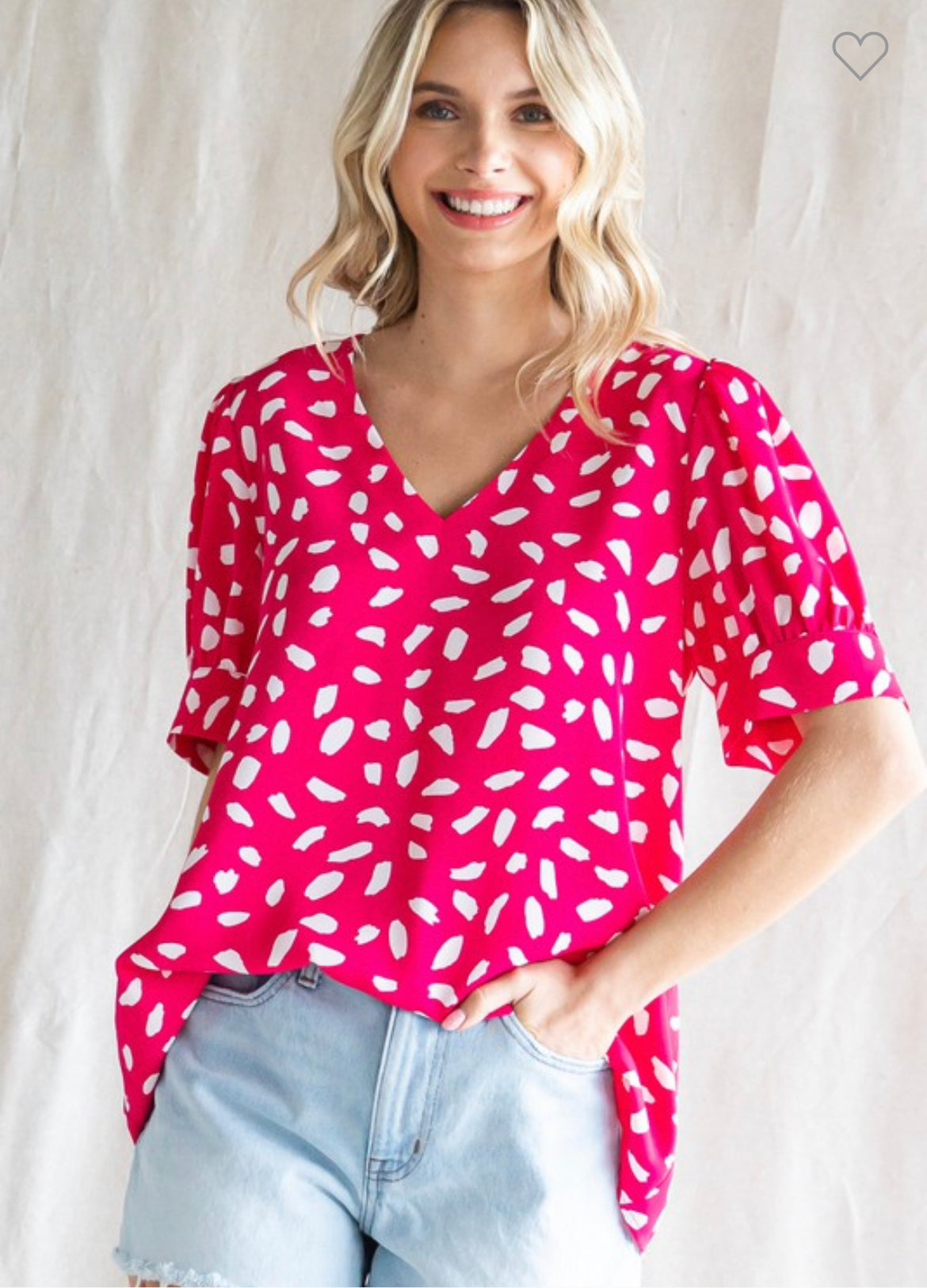 Barbie Pink Leopard V-neck top with tucked sleeves and angled cuffs. Lightweight, unlined, and non-sheer. Runs true to size.