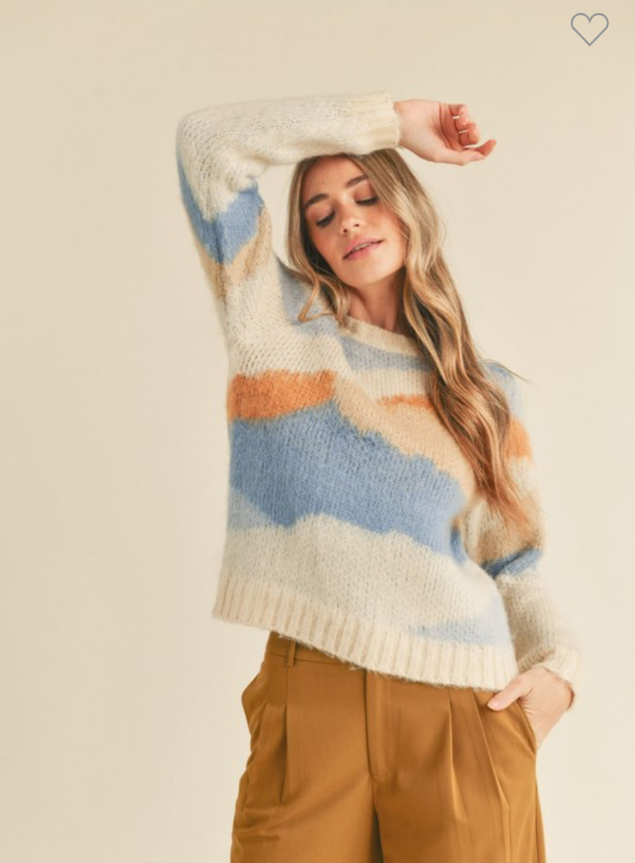 Abstract sweater with a true-to-size fit, ribbed neckline, cuffs, and hem. Loose fit pullover.