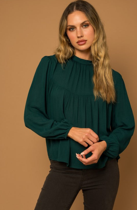 Women's long sleeve top with mock neck and button back detail, true to size fit, available at Onyx Native.