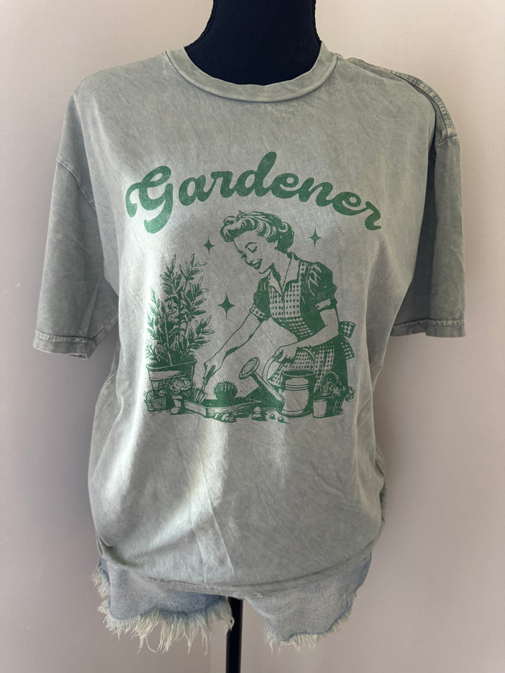 mannequin view of GARDENER Mineral Washed Graphic Top, 100% premium cotton jersey, relaxed unisex fit, screen-printed with water-based ink, exclusive Oat Collective label.
