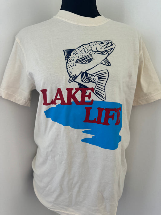 Lake Life tee printed on a Comfort Colors shirt, made of 100% cotton in natural color with a custom design, offering a true-to-size fit and minimal shrinkage.